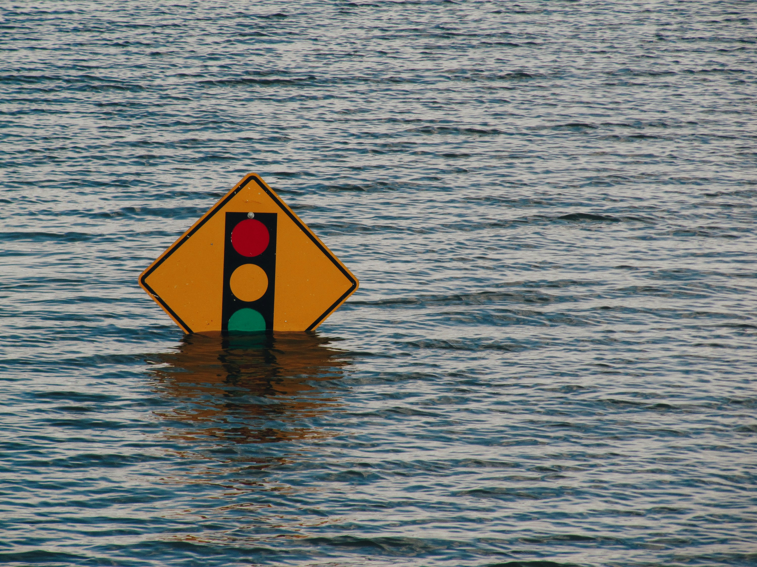 traffic sign submerged by flood water