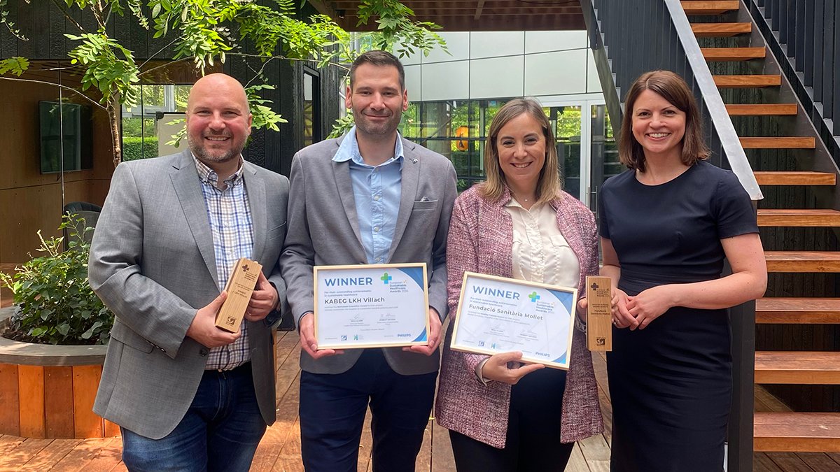 People standing holding the 2024 European Sustainable Healthcare Awards