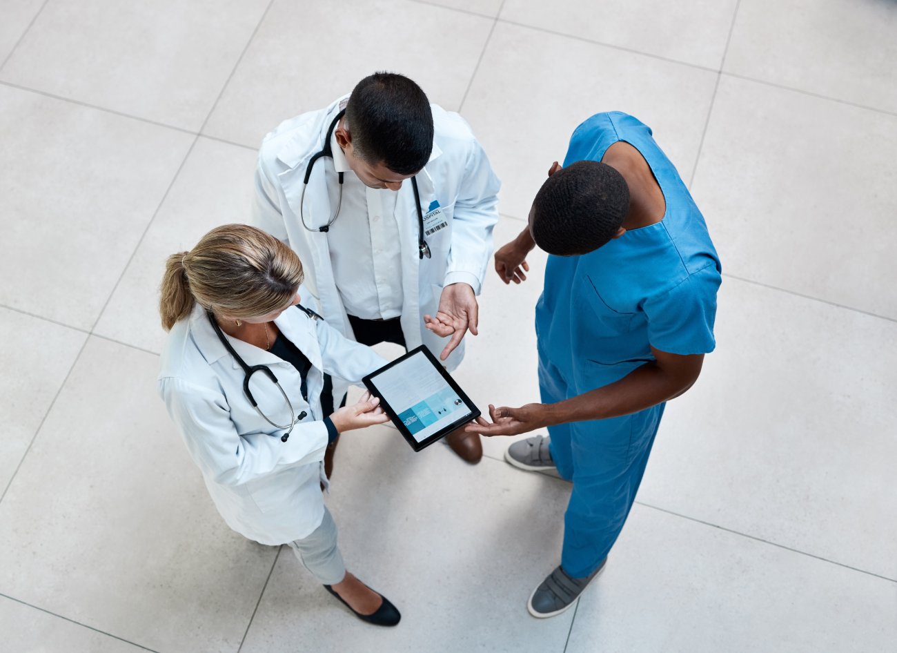 doctors and nurses holding tablet